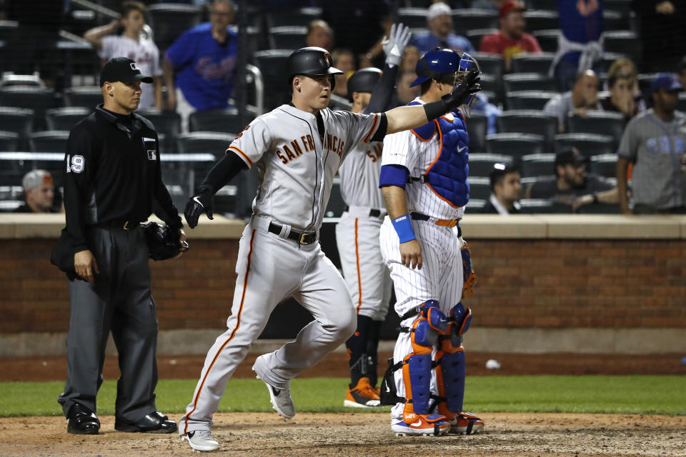 NEW YORK, NEW YORK - JUNE 04: Tyler Austin #19 of the San Francisco Giants reacts to teammates after scoring against the New York Mets during the tenth inning at Citi Field on June 04, 2019 in New York City. (Photo by Michael Owens/Getty Images)