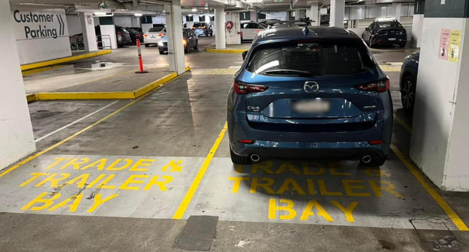 Blue Mazda car parked in Bunnings car park Trade and Trailer Bay 