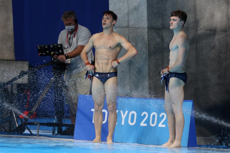 Tom Daley and Matty Lee of Team Great Britain look on during the Men's Synchronised 10m Platform Final on day three of the Tokyo 2020 Olympic Games on July 26, 2021 in Tokyo, Japan (Getty Images)