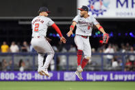 Washington Nationals second baseman Luis Garcia Jr. (2) and right fielder Eddie Rosario (8) celebrate after the Nationals beat the Miami Marlins 3-1 in a baseball game, Friday, April 26, 2024, in Miami. (AP Photo/Wilfredo Lee)