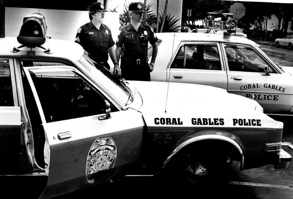 In 1983, Coral Gables officers show off new and older city police cars.