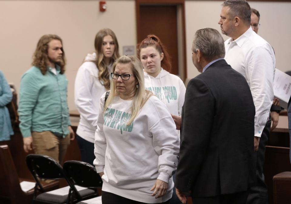 Stacy Bailey, the mother of Tristyn Bailey, leads her family out of the courtroom Monday after the judge accepted Aiden Fucci's plea of guilty in her 2021 murder. Jury selection had been scheduled to begin Monday before the unexpected plea.