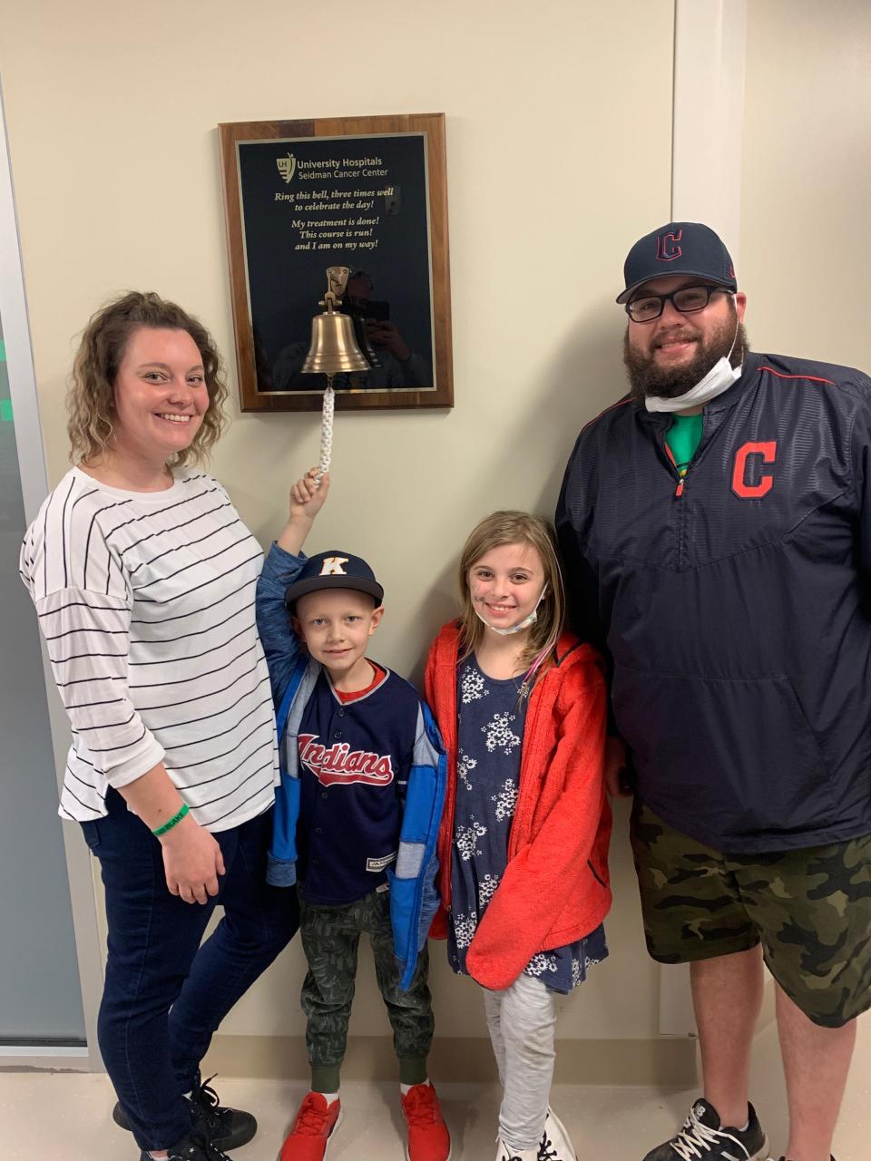 Blake Michel rings the bell at his last radiation treatment at University Hospitals Rainbow Babies & Children's in Cleveland. He completed 28 treatments. He is shown with his mom Morgan Michel, left, sister Ryleigh Michel and dad Jacob Michel.