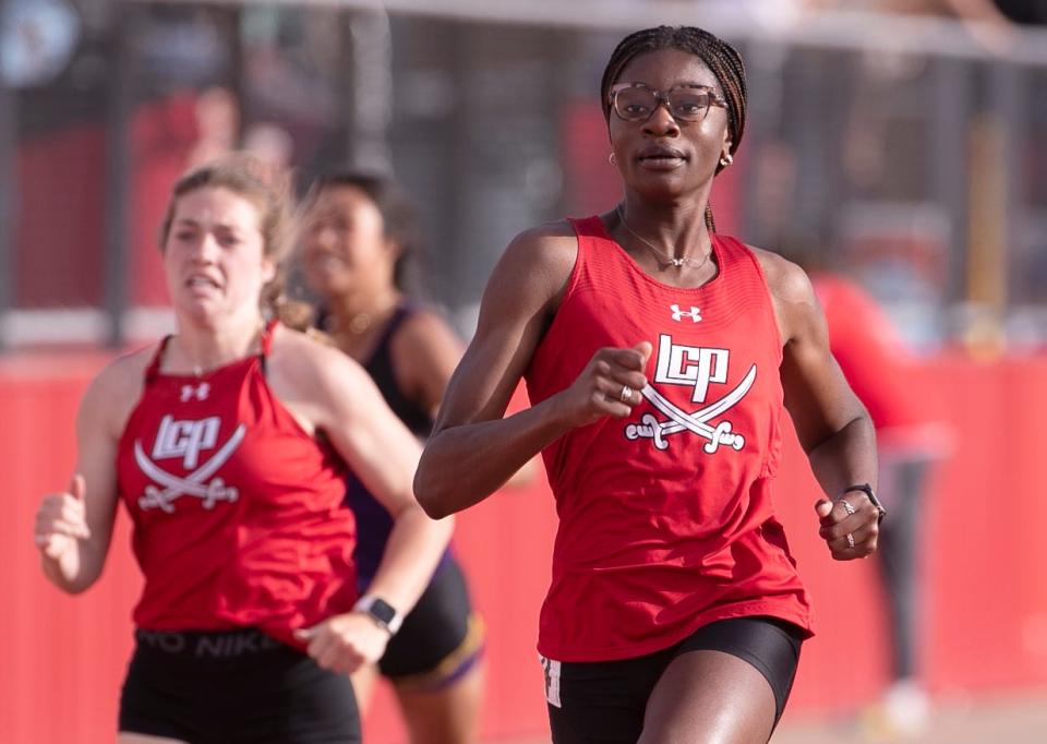 Lubbock-Cooper’s Niomi Wines competes in the 200 meter dash during the District 4-5A track and field meet, Thursday, April 13, 2023, at Pirate Stadium in Woodrow. 