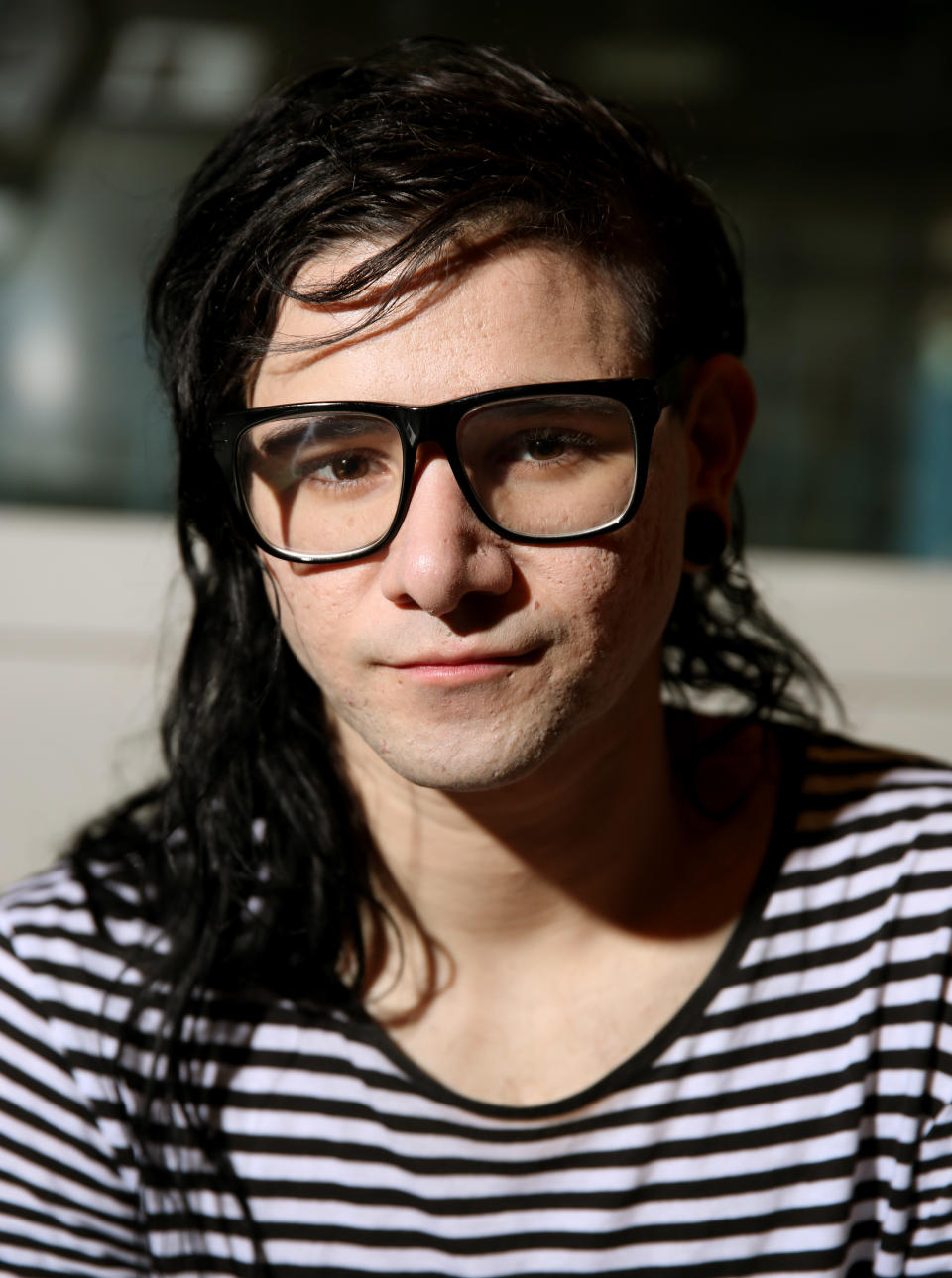 In this Thursday, March 6, 2014 photo, electronic music DJ and producer, Skrillex, whose real name is Sonny Moore, poses for a portrait in Los Angeles. The 26-year-old Grammy Award winner's first official album, "Recess," is out on Tuesday, March 18, 2014. (Photo by Matt Sayles/Invision/AP)