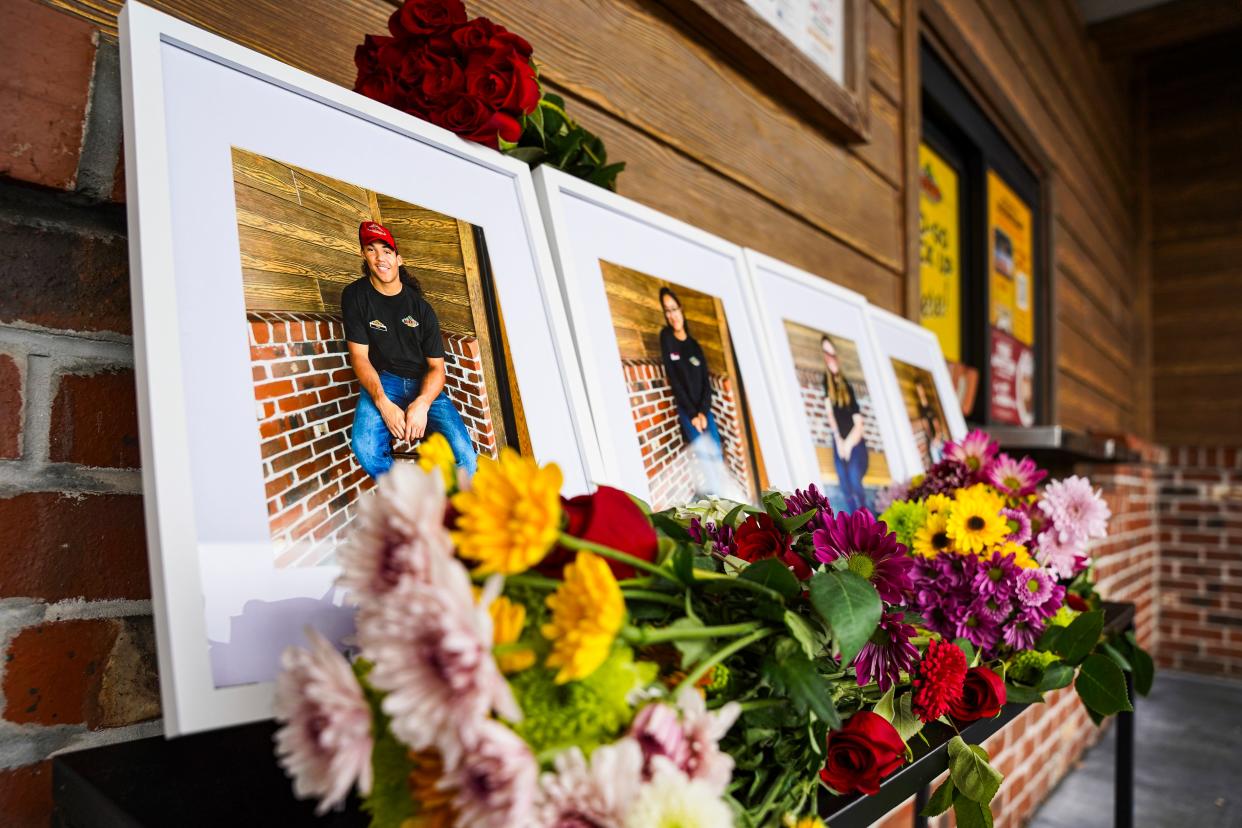 Portraits of the four employees who drowned are on display at Texas Roadhouse in Fort Myers on Monday, June 26, 2023.