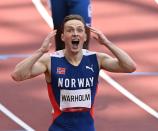 <p>Norway's Karsten Warholm is in disblief after winning the gold medal in the Men's 400m Hurdles Final at Olympic Stadium on August 3.</p>