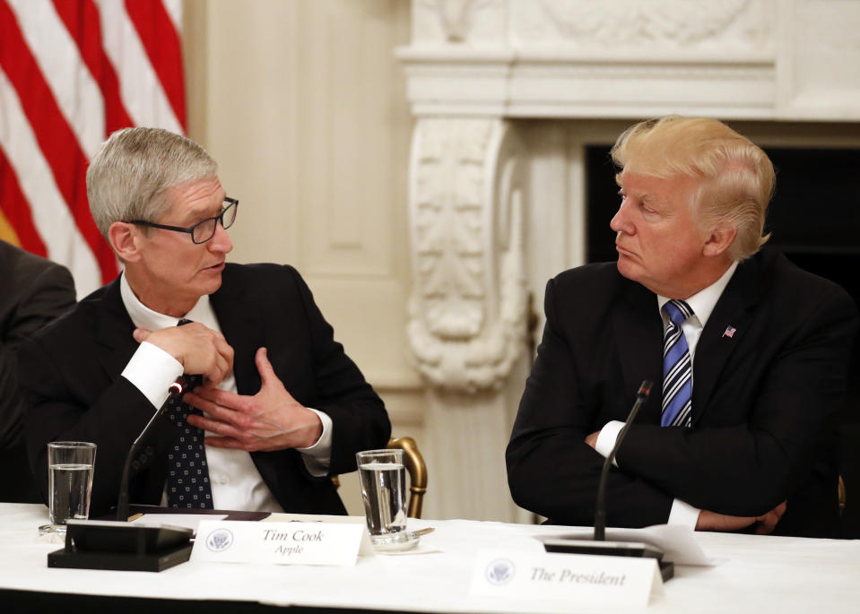 Tim Cook, Chief Executive Officer of Apple, speaks as President Donald Trump listens during an American Technology Council roundtable in the State Dinning Room of the White House, Monday, June 19, 2017, in Washington. (AP Photo/Alex Brandon)