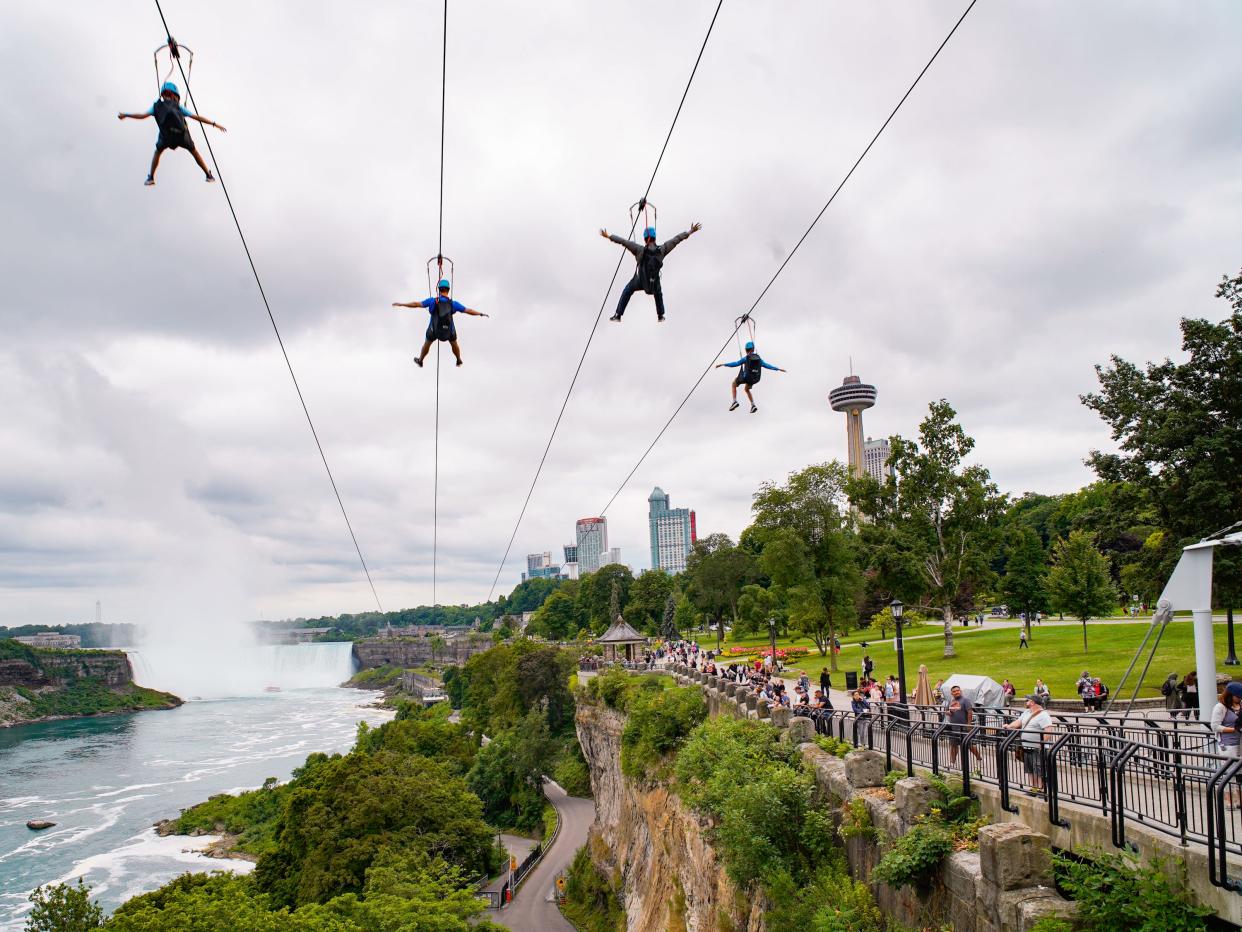 Zipliners above Niagara Falls