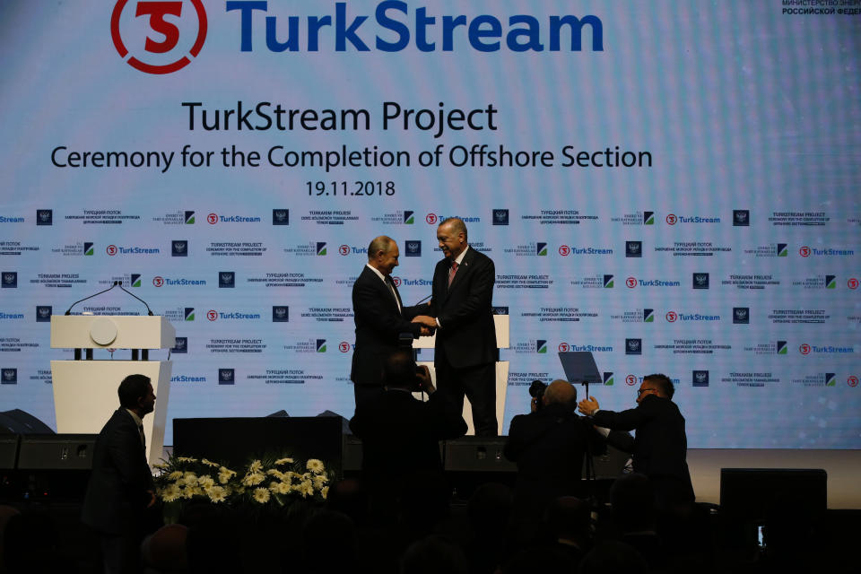 Russian President Vladimir Putin, left, and Turkey's President Recep Tayyip Erdogan, shake hands after attending an event marking the completion of one of the phases of the Turkish Stream natural gas pipeline, in Istanbul, Monday, Nov. 19, 2018. The two 930-kilometer (578-mile) lines when finished are expected to carry 31.5 billion cubic meters (1.1 trillion cubic feet) of Russian natural gas annually to European markets, through Turkish territories. (AP Photo/Lefteris Pitarakis)