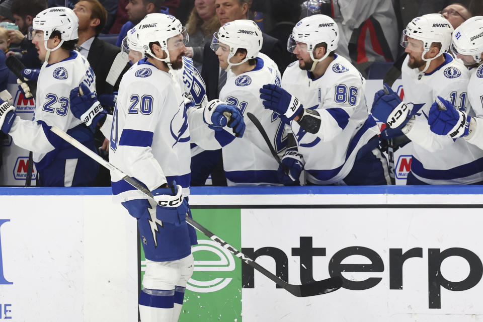 Tampa Bay Lightning left wing Nicholas Paul (20) is congratulated at the bench after scoring a goal during the first period of an NHL hockey game against the Buffalo Sabres, Saturday, Jan. 20, 2024, in Buffalo, N.Y. (AP Photo/Jeffrey T. Barnes)