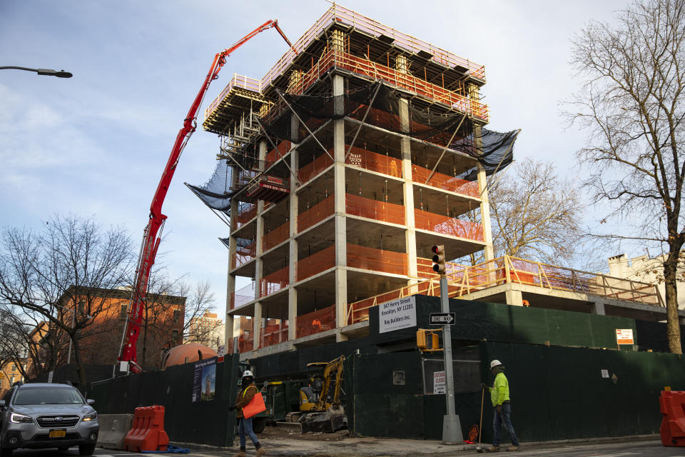 BROOKLYN, NEW YORK - DECEMBER 18: A construction crew pours concrete on the 6th floor of a 15-story residential apartment building in the Cobble Hill neighborhood of Brooklyn, New York on December 18, 2018. The residential building is being constructed on the land of the former Long Island College Hospital, LICH, that was sold to the developers, Fortis Property Group. (Photo by Robert Nickelsberg/Getty Images)