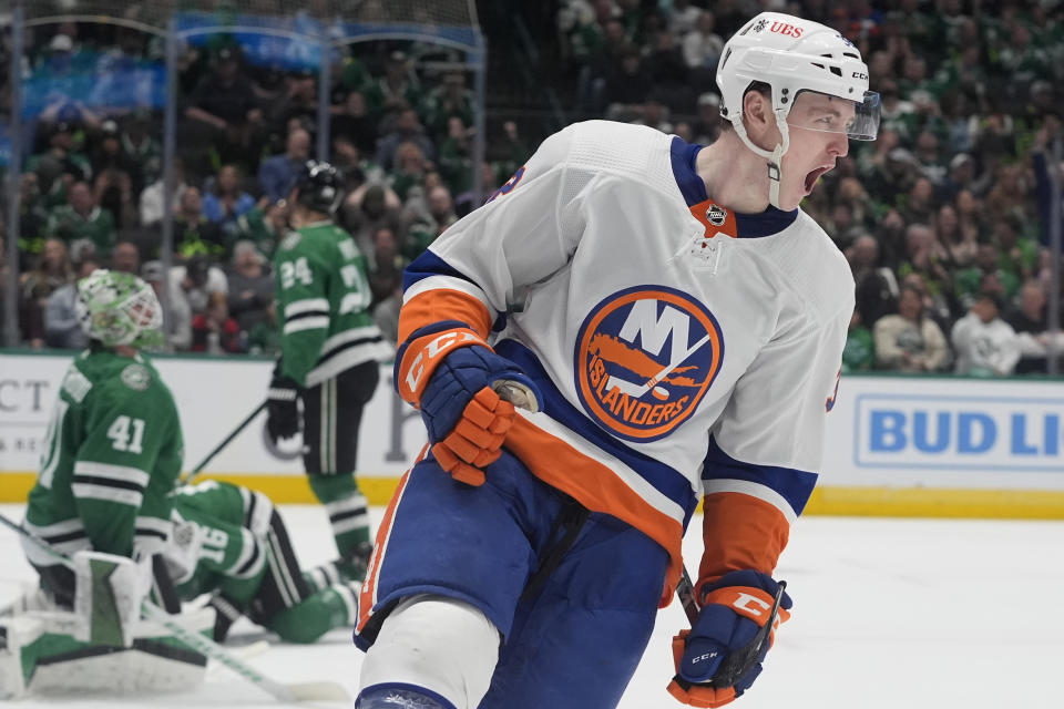 New York Islanders center Kyle MacLean, foreground, celebrates after scoring against Dallas Stars goaltender Scott Wedgewood (41) during the second period of an NHL hockey game in Dallas, Monday, Feb. 26, 2024. (AP Photo/LM Otero)