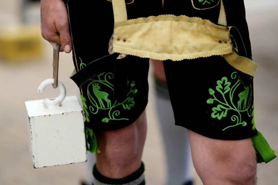 A competitor warms up for his bout at the German Championships in Fingerhakeln or finger wrestling, in Bernbeuren, Germany, Sunday, May 12, 2024. Competitors battled for the title in this traditional rural sport where the winner has to pull his opponent over a marked line on the table. (AP Photo/Matthias Schrader)