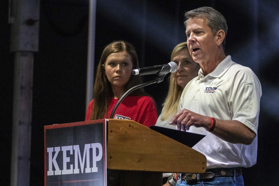 Gov. Brian Kemp announces his bid for re-election at the Georgia National Fairgrounds surrounded by his family on Saturday, July 10, 2021 in Perry, Ga. (Clay Teague/The Macon Telegraph via AP)