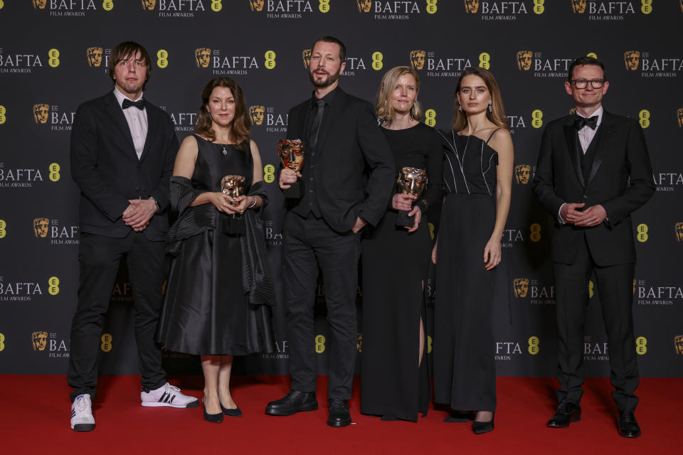 Associated Press photographer Evgeniy Maloletka, from left, PBS editor-in-chief of frontline and producer Raney Aronson, director, producer and AP journalist Mstyslav Chernov, editor and producer Michelle Mizner, field producer and AP video journalist Vasilisa Stepanenko, and producer and AP vice president and head of production Derl McCrudden, winners of the documentary award for '20 Days in Mariupol', pose for photographers at the 77th British Academy Film Awards, BAFTA's, in London, Sunday, Feb. 18, 2024. (Photo by Vianney Le Caer/Invision/AP)