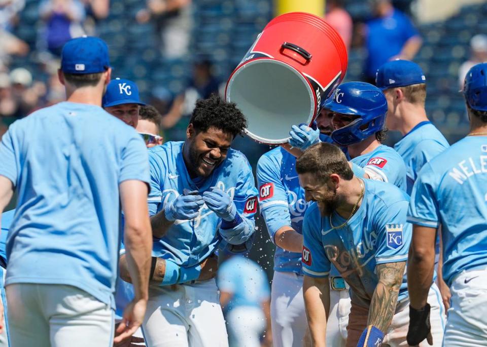 Kansas City Royals third baseman Maikel Garcia (11) celebrates with teammates after defeating the New York Yankees at Kauffman Stadium on June 13, 2024.