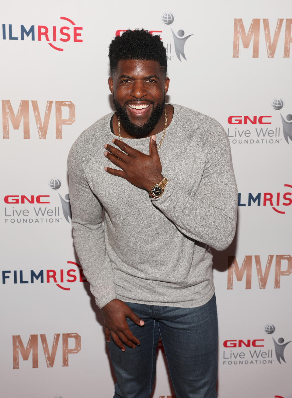 Emmanuel Acho Wearing Grey Shirt