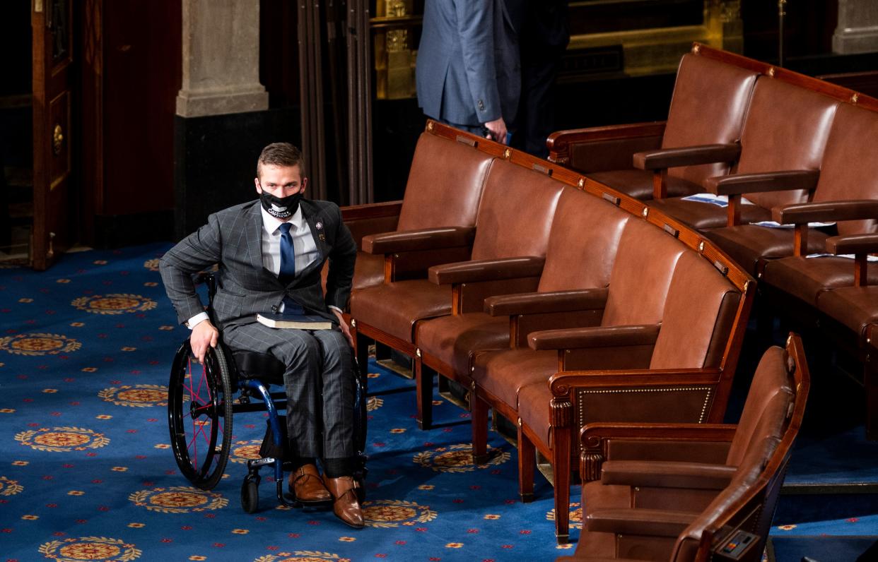 Rep. Madison Cawthorn, R-NC, arrives on the House floor in the Capitol in Washington, DC, before being sworn in, January 3, 2021. (Photo by Bill Clark / POOL / AFP) (Photo by BILL CLARK/POOL/AFP via Getty Images)