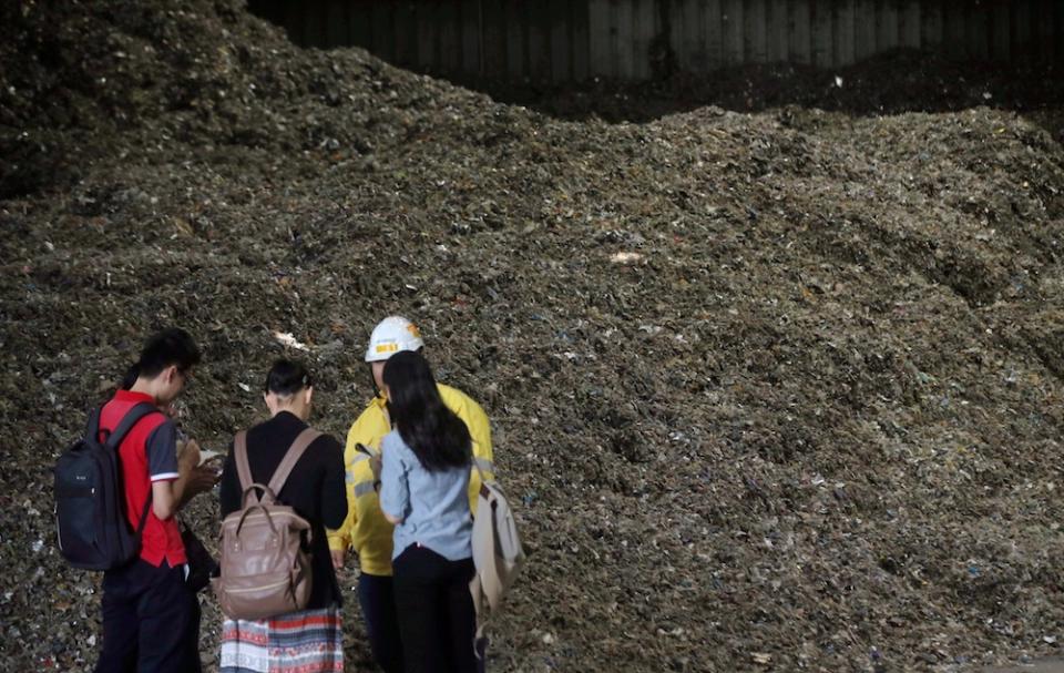 Reporters are seen during a visit to alternative fuel manufacturer ResourceCo Asia in Chemor July 17, 2019. — Picture by Farhan Najib