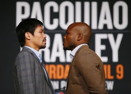 Jan 21, 2016; New York, NY, USA; Manny Pacquiao and Timothy Bradley, Jr. pose for a photo during press conference at Madison Square Garden to announce the upcoming boxing fight on April 9, 2016 in Las Vegas. Mandatory Credit: Noah K. Murray-USA TODAY Sports