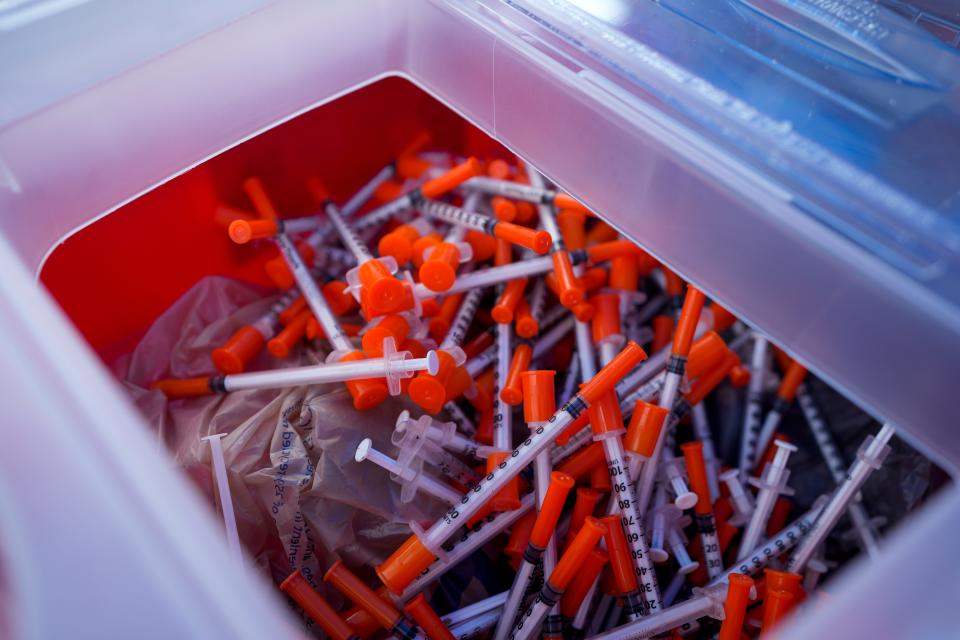 Used syringes are collected in a large sharps container at the Butler County General Health District-funded syringe and safe drug use program in Middletown. The program will close after its hours on Sept. 1 due to safety concerns at the parking lot on South Dixie Highway and cannot reopen elsewhere due to a lack of community support.