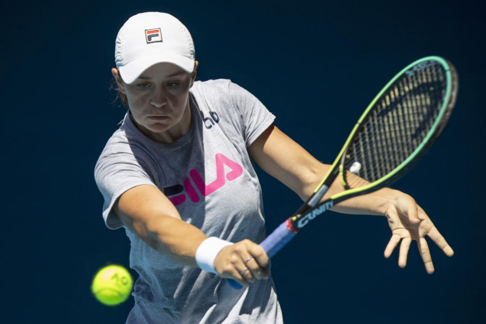Australia's Ash Barty hits a backhand during practice on Rod Laver Area ahead of the Australian Open tennis championships in Sunday, Jan. 16, 2022, in Melbourne, Australia. (AP Photo/Simon Baker)