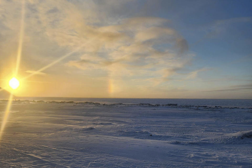 FILE - The view from the front of the school in in Wales, Alaska, where a 24-year-old woman and her 1-year-old son were killed in an encounter with a polar bear, Jan. 17, 2023, is seen in this photo taken on Jan. 15. A polar bear that killed a young mother and her baby on Jan. 17, in western Alaska was likely an older bear in poor body condition, but officials say tests were negative for pathogens that affect the brain and cause aggressive behavior. (Chrissy Friberg via AP, File)