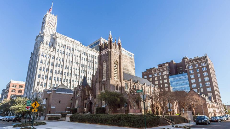 Jackson, MS/USA - circa February 2016: Lamar Life Building and St Andrew's Episcopal Cathedral in Downtown Jackson, Mississippi.