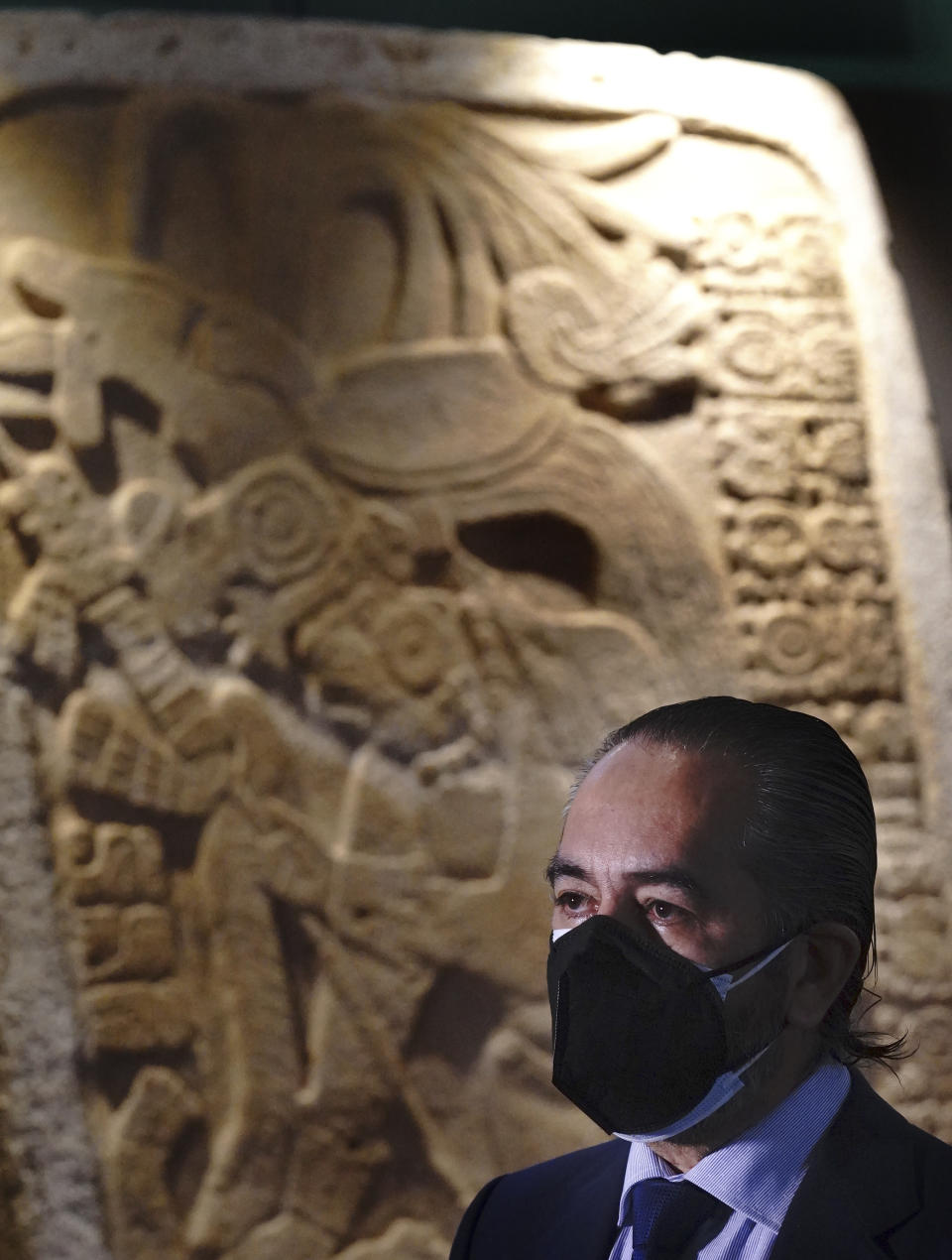 Miguel Angel Trinidad Melendez, of the National Coordination of Museums and Exhibitions of the National Institute of Anthropology and History, takes part in the launch of “The Greatness of Mexico” exhibition, displaying for the first time in the country more than 800 pieces repatriated from abroad in the last three years and others that were in safekeeping and confiscation warehouses, at the Anthropology Museum in Mexico City, Friday, Oct. 1, 2021. (AP Photo/Marco Ugarte)