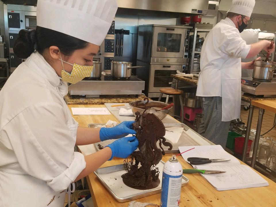 A student with the Culinary Institute of the Carolinas works during a Pastry class, where in addition to learning about the industry, students must also follow new safety measures due to COVID-19 like social distancing and wearing masks.