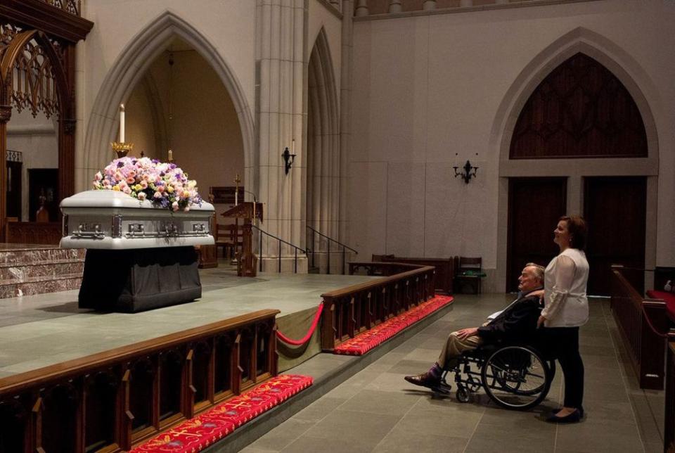 George H.W. Bush alongside daughter Dorothy as he gazed up at his wife, Barbara's, casket