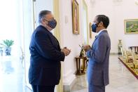 U.S. Secretary of State Mike Pompeo talks with Indonesian President Joko Widodo during their meeting at the Presidential Palace in Bogor