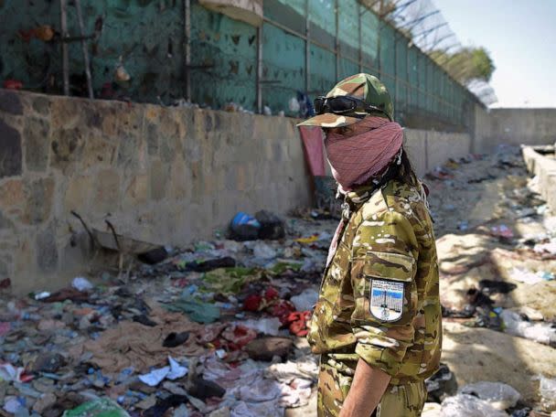 PHOTO: FILE - A Taliban fighter stands guard at the site of the August 26 twin suicide bombs, which killed scores of people including 13 US troops, at Kabul airport, Aug. 27, 2021. (Wakil Kohsar/AFP via Getty Images, FILE)