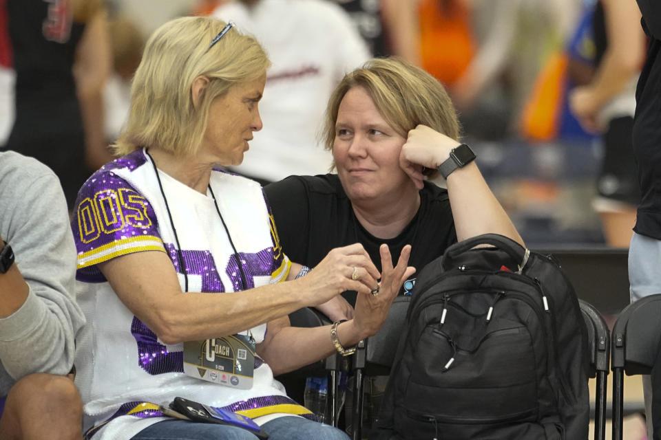 LSU women's head basketball coach Kim Mulkey, left, speaks with NCAA Vice President for Women's Basketball Lynn Holzman at the NCAA College Basketball Academy, Saturday, July 29, 2023, in Memphis, Tenn. (AP Photo/George Walker IV)