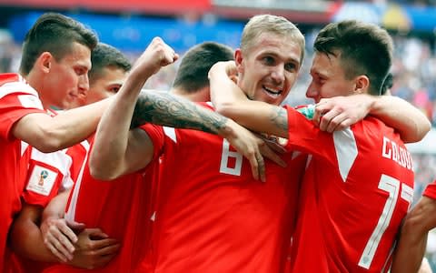 Russia's Yuri Gazinsky celebrates with teammates after scoring his side's first goal  - Credit: AP Photo/Matthias Schrader