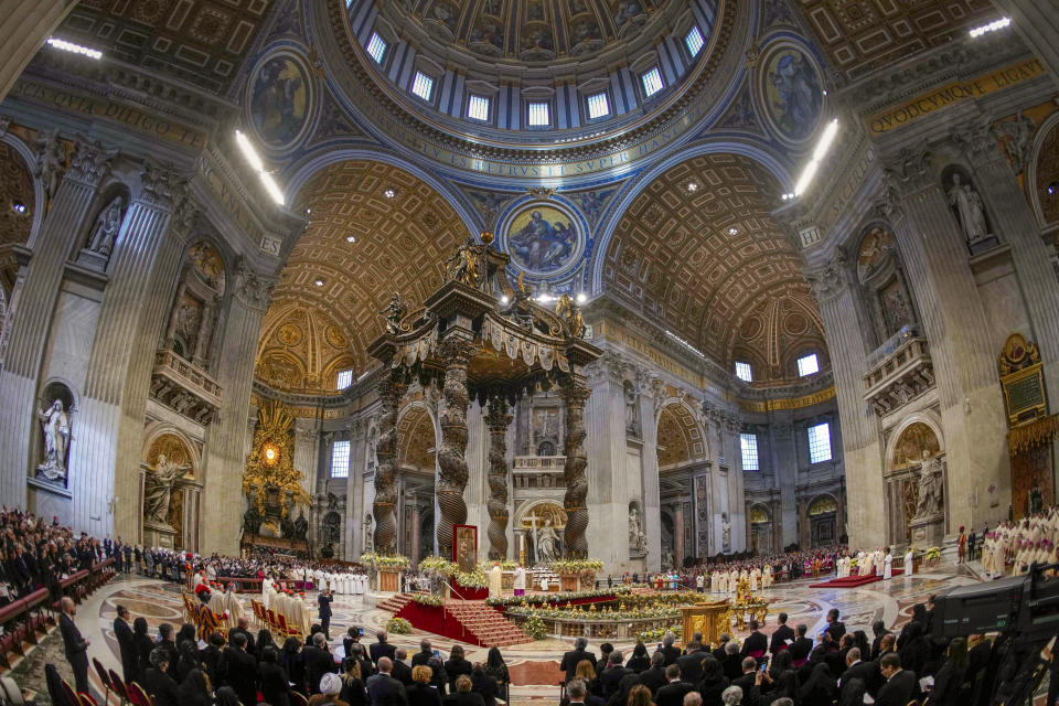 FILE - Pope Francis presides over a solemn mass in St. Peter's Basilica at The Vatican, Monday, Jan. 1, 2024. Vatican officials unveiled plans, Thursday, Jan. 11, 2024, for a year-long, 700,000 euro restoration of the 17th century, 95ft-tall bronze canopy by Giovan Lorenzo Bernini surmounting the papal Altar of the Confession of the Basilica, pledging to complete the first comprehensive work on this masterpiece in 250 years before Pope Francis' big 2025 Jubilee. (AP Photo/Andrew Medichini, File)