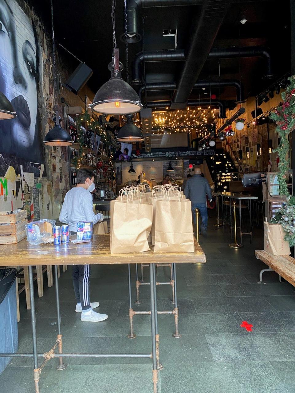 Bags of food lined up at Little Drunken Chef in White Plains for Thanksgiving 2020, the first one Chef/Owner Bonnie Saran did as a free to-go meal, due to the pandemic.