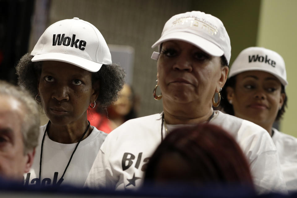 Supporters of President Donald Trump wait to listen to him speak during the launch of "Black Voices for Trump," at the Georgia World Congress Center, Friday, Nov. 8, 2019, in Atlanta. (AP Photo/ Evan Vucci)