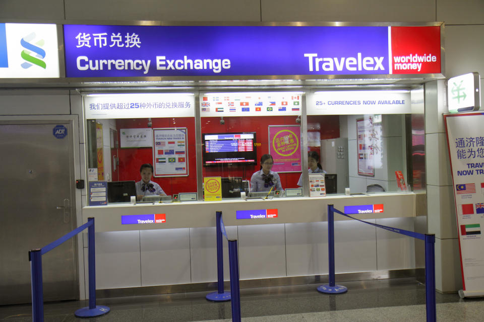 Shanghai Pudong International Airport, Currency exchange, Travelex, front window. (Photo by:  Jeffrey Greenberg/Universal Images Group via Getty Images)