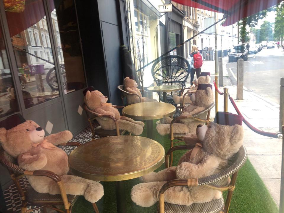 Cuddly toy bears sit in seats at Tagine in Balham to enforce social distancing at the restaurant