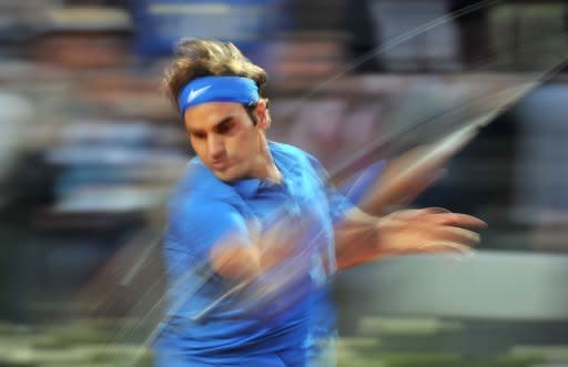 Swiss Roger Federer returns a ball to Serbia's Novak Djokovic during their semi-finals match of the ATP Rome tournament. Djokovic ended Federer's brilliant run of recent clay form, defeating the world number two, and last week's Madrid champion, 6-2, 7-6 (7/4)