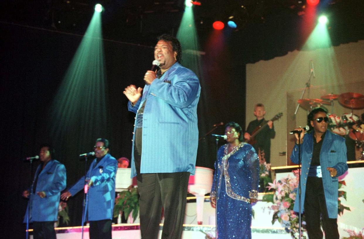 Eddie Stovall leads "The Platters" while singing "Stand By Me" during a performance in October 2000 in Branson, Mo. Members of the group shown here are, from left, Walter White, Lawrence "Rooster" Randle, Stovall, Dee Dee Hamilton and Willie Nash.