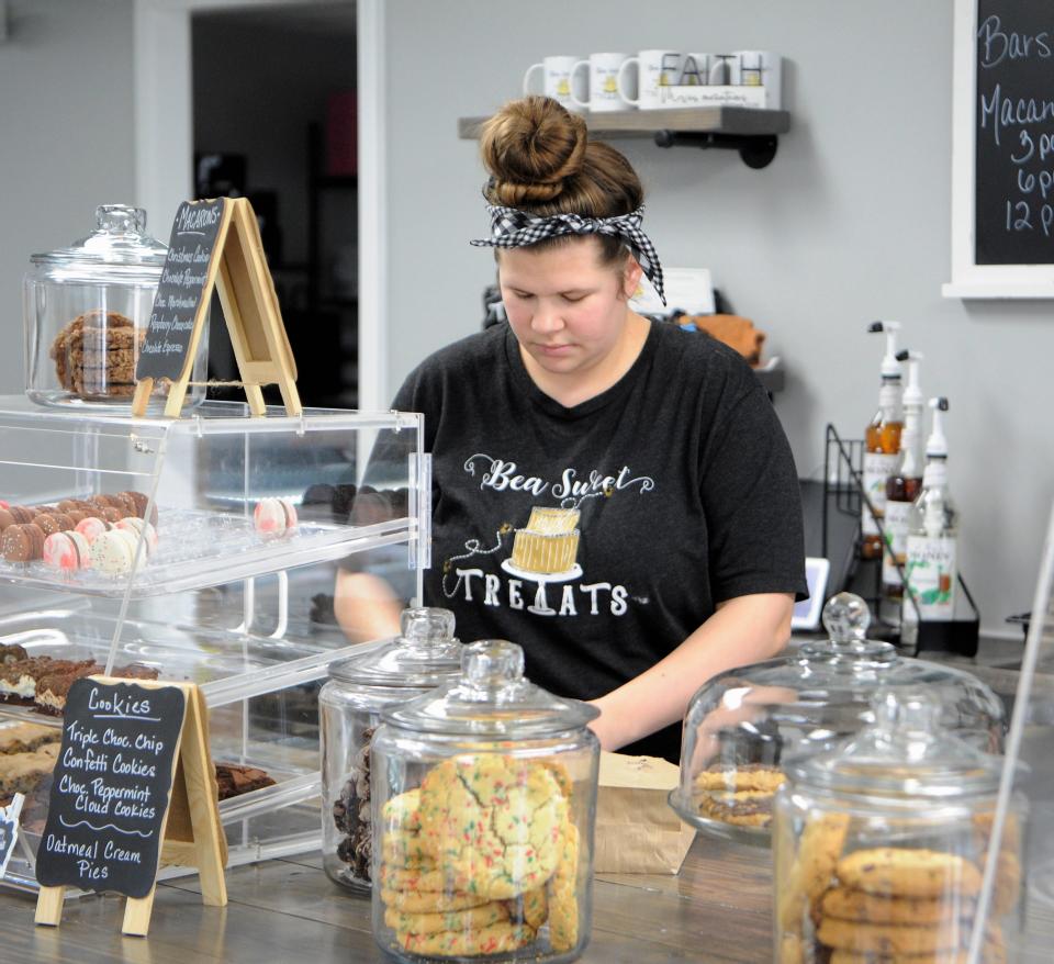 Ashley Corbetta works behind the counter at Bea Sweet Treats on Tuesday, Dec. 14, 2021.