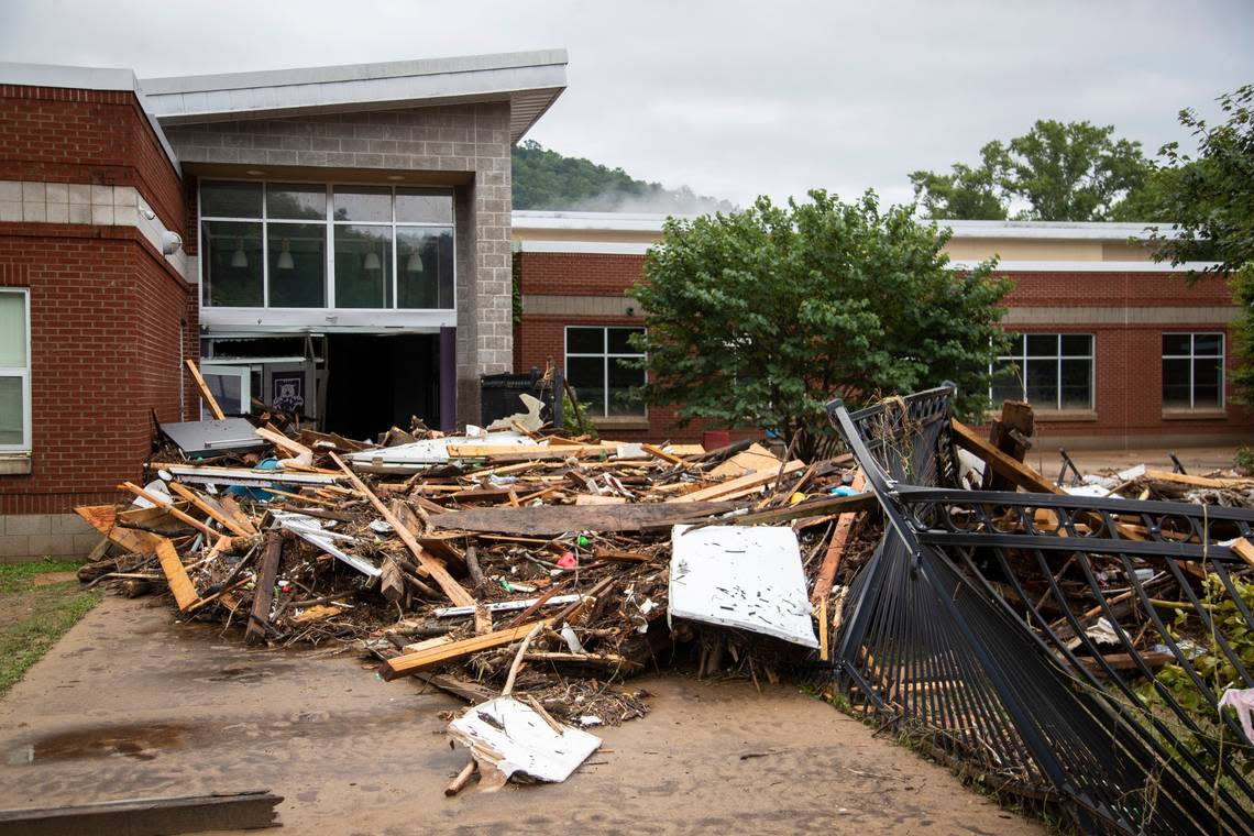 Piles of debris sits outside the Buckhorn School after flooding swept through Buckhorn in Perry County, Ky., Friday, July 29, 2022. Silas Walker/swalker@herald-leader.com