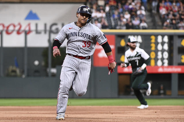 Minnesota Twins first baseman Donovan Solano, left, New York