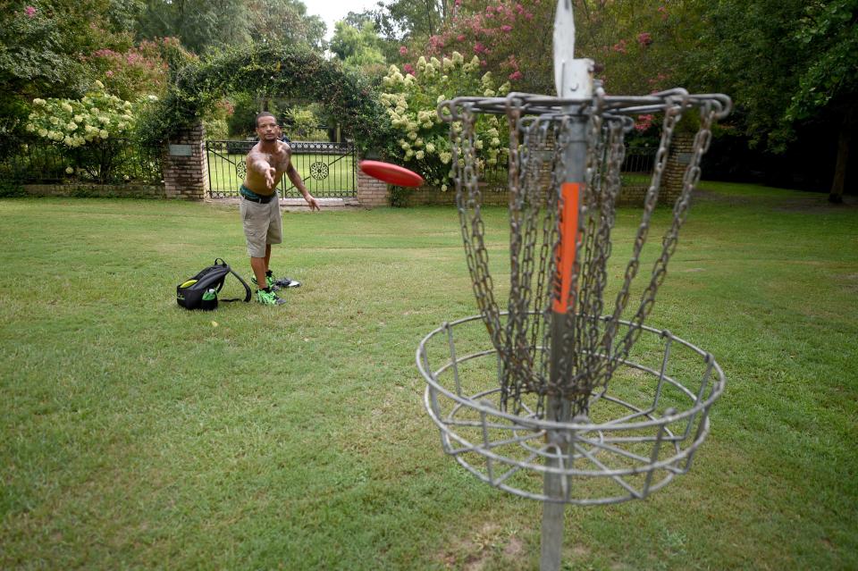 Joseph Horsfall plays disc golf on an August afternoon at Pendleton King Park in Augusta.