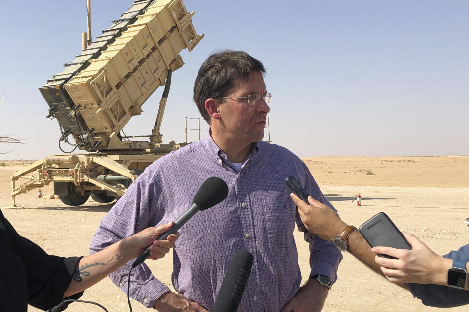 Defense Secretary Mark Esper talks to reporters at Prince Sultan Air Base in Saudi Arabia, Tuesday, Oct. 22, 2019, where he saw a Patriot missile battery that the US sent to Saudi to help protect the kingdom against the Iranian threat. (AP Photo/Lolita Baldor)