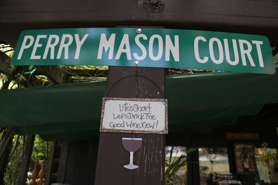 In this photo taken Thursday, April 11, 2013 a couple of signs hang outside the tasting room at Raymond Burr Vineyards in Healdsburg Calif. The star of TV’s “Perry Mason” and “Ironside,” also had a passion for wine, which is still celebrated at this small winery in Sonoma County’s Dry Creek Valley. (AP Photo/Eric Risberg)