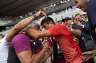 Serbia's Novak Djokovic hugs his coach Goran Ivanisevic as he celebrates winning the men's singles final match of the French Open tennis tournament against Norway's Casper Ruud in three sets, 7-6, (7-1), 6-3, 7-5, at the Roland Garros stadium in Paris, Sunday, June 11, 2023. Djokovic won his record 23rd Grand Slam singles title, breaking a tie with Rafael Nadal for the most by a man. (AP Photo/Thibault Camus)